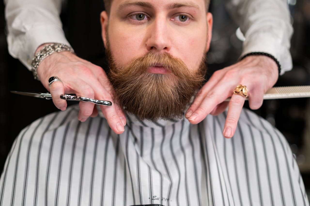 Beard trim framing the jaw with a controlled line.
