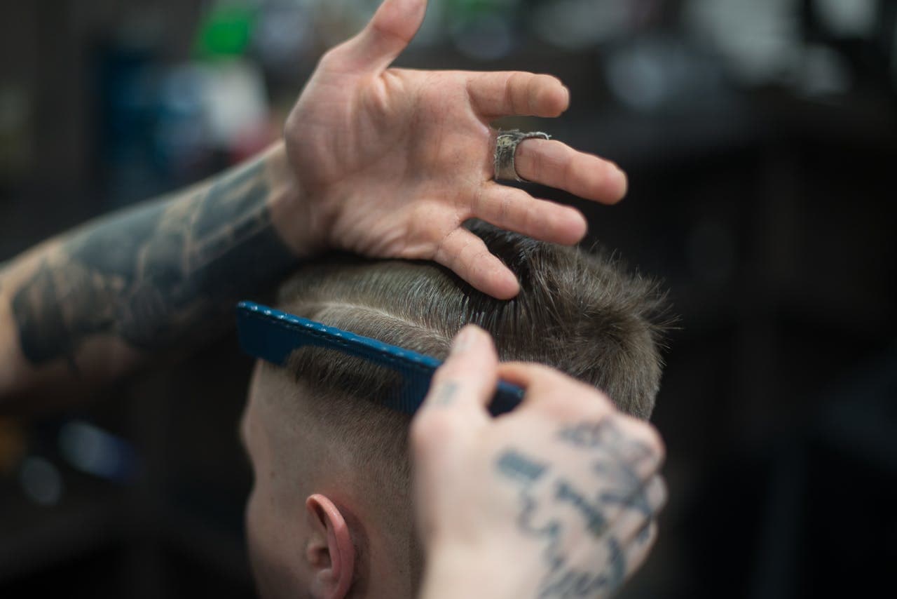 Restyled haircut with layered shape and polished finish.