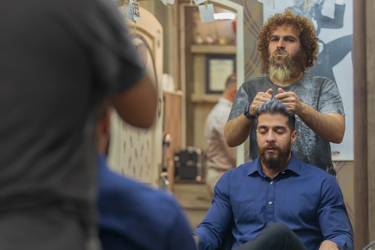 Warm backlit haircut finishing shot.