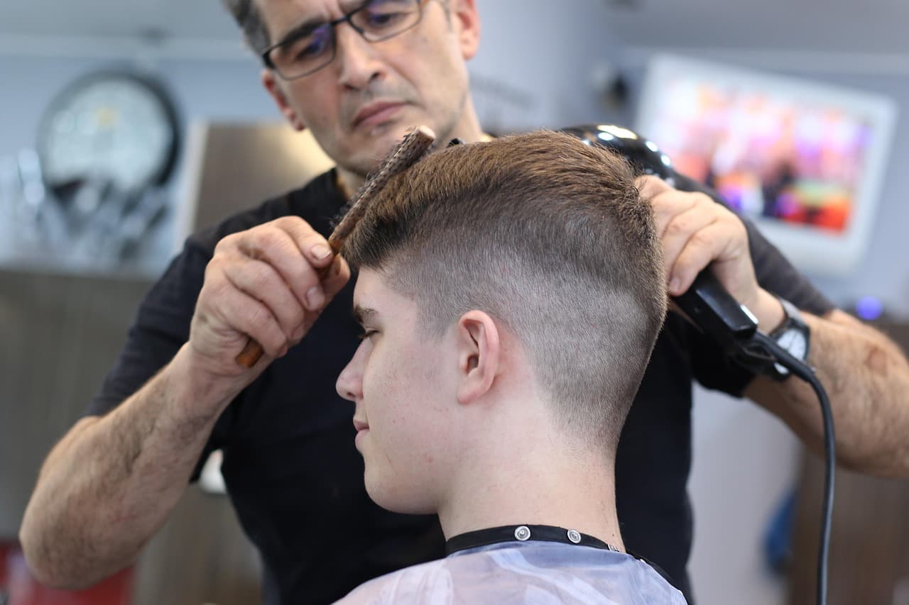 Clean haircut finish with a sharp fade