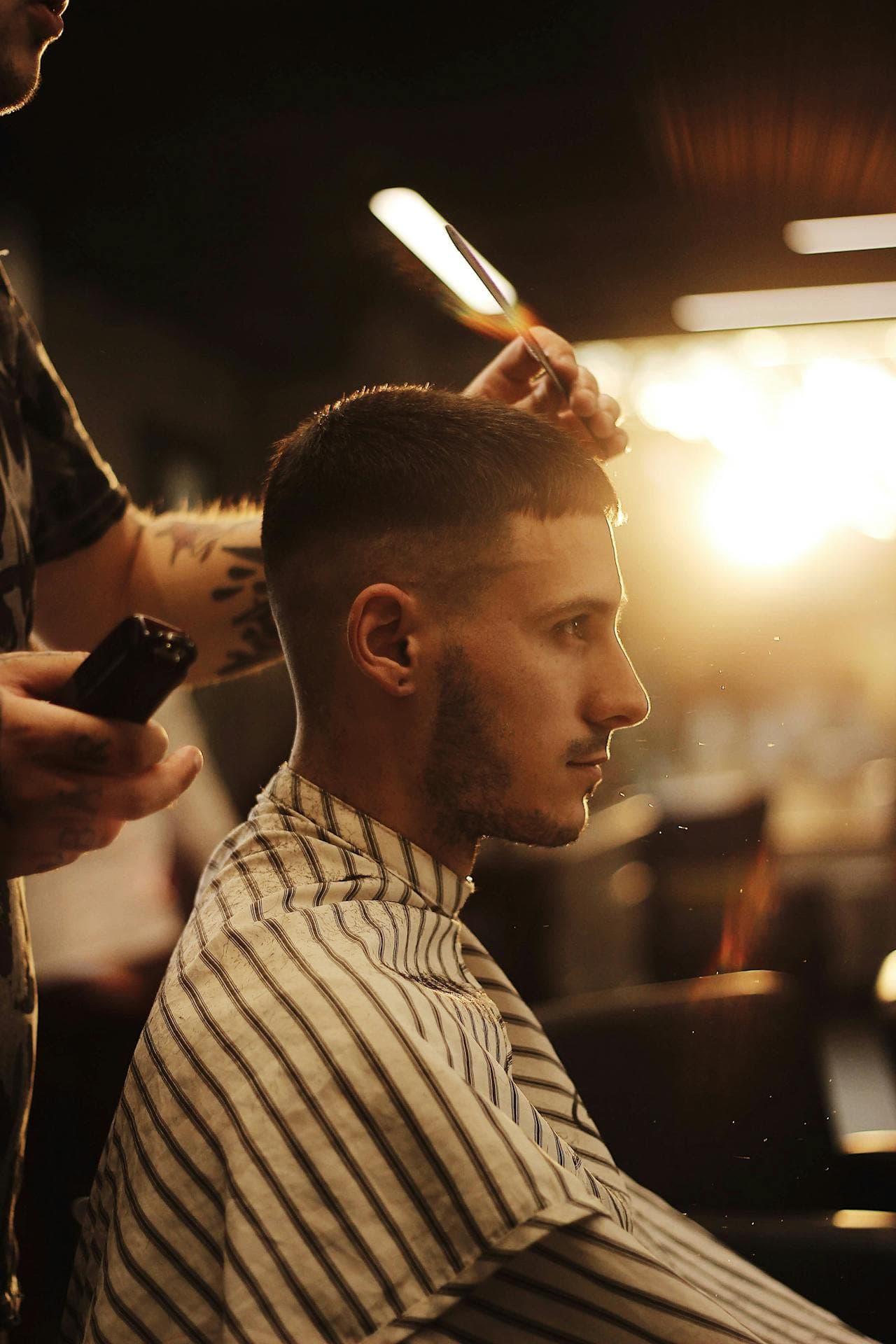 Close haircut detail with shears lifted over the top.