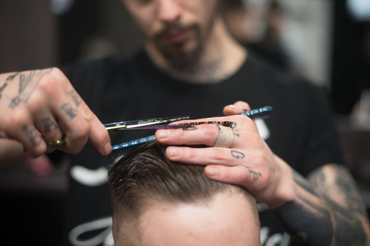 Close-cropped fade service showing technical clipper work.