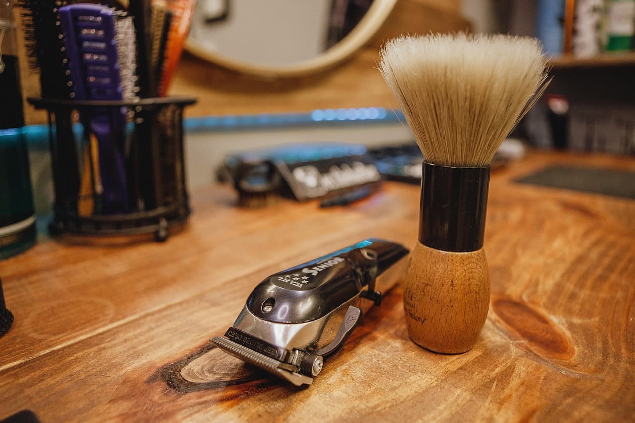Editorial barbershop tools arranged for a refined grey blending appointment.