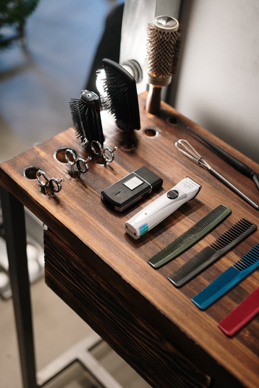 Polished clipper heads lit as a studio still life.